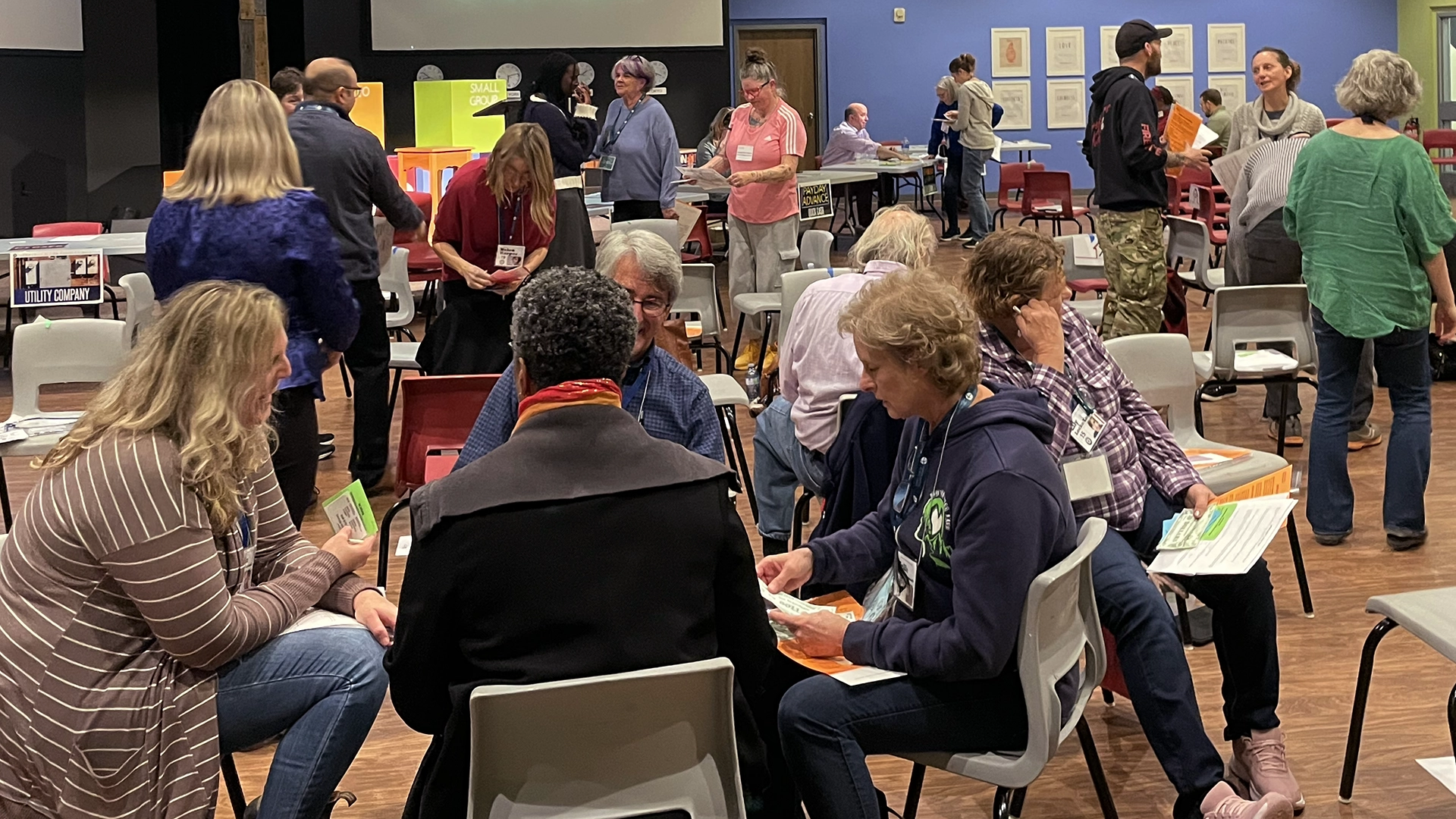 a group of people sitting in chairs in a room